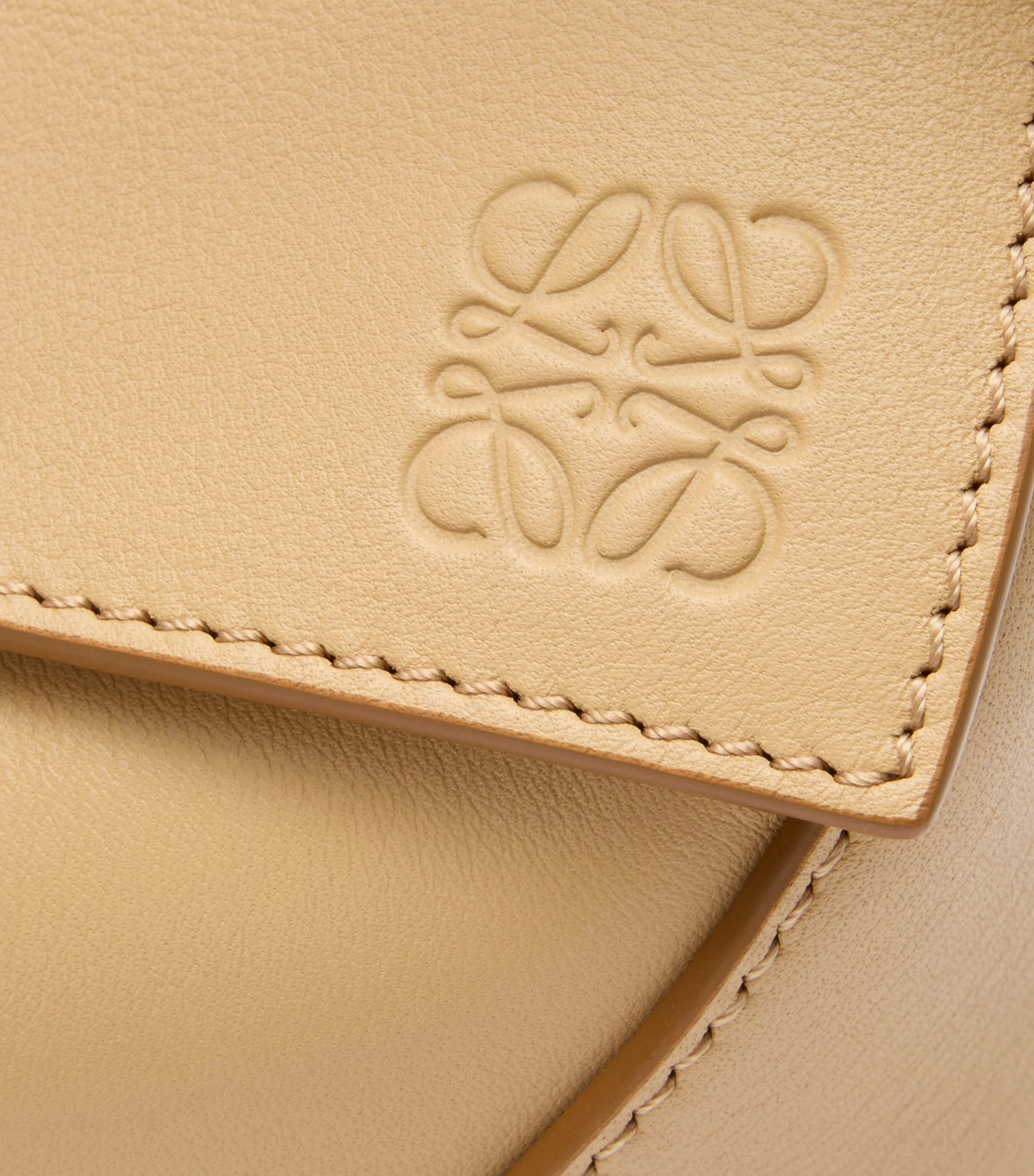 Small Leather Puzzle Edge Top-Handle Bag