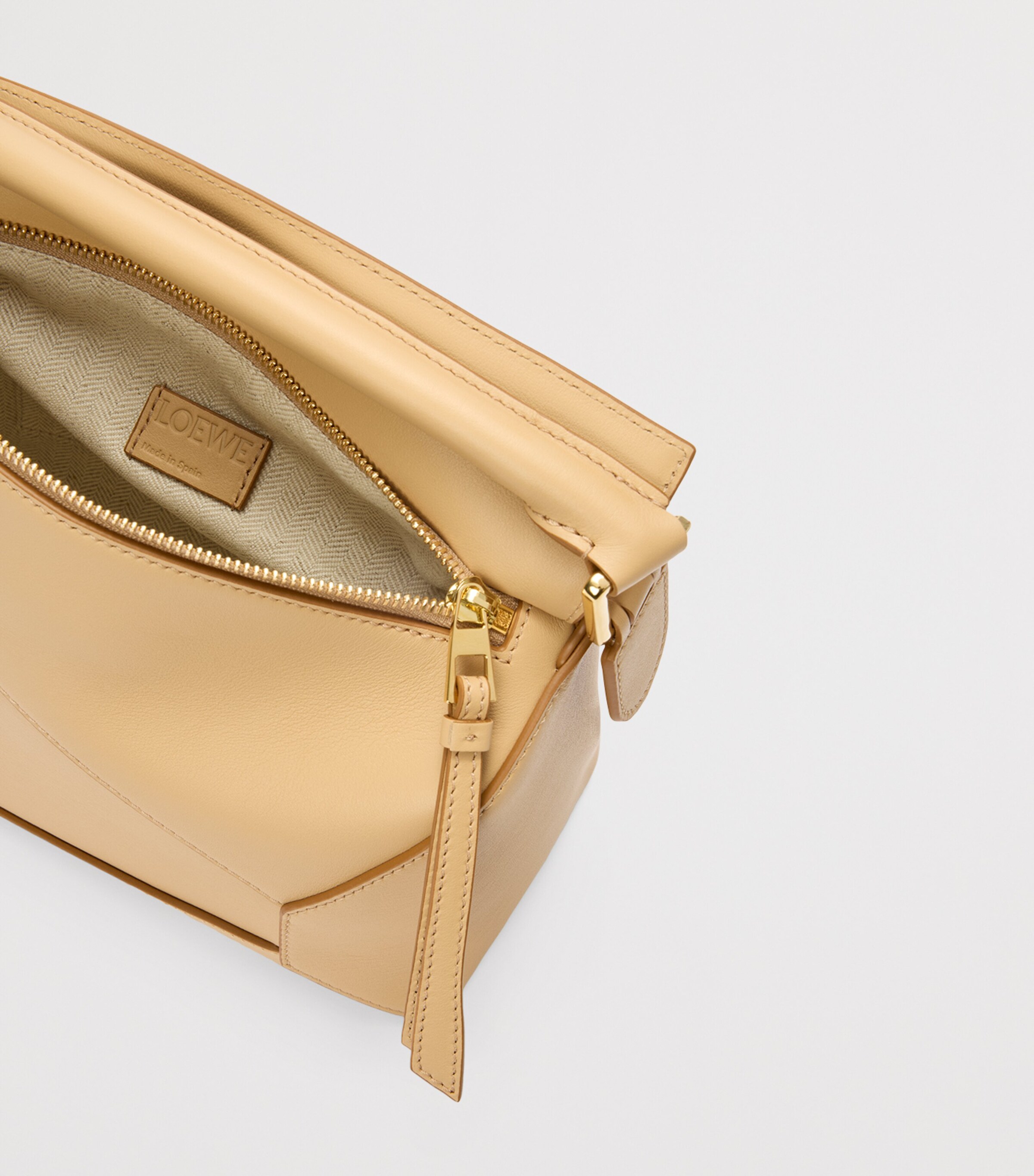 Small Leather Puzzle Edge Top-Handle Bag